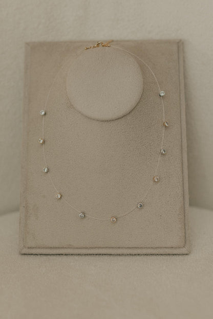 Colar Fio de Nylon Pontos de Luz Dourado e Ródio Branco