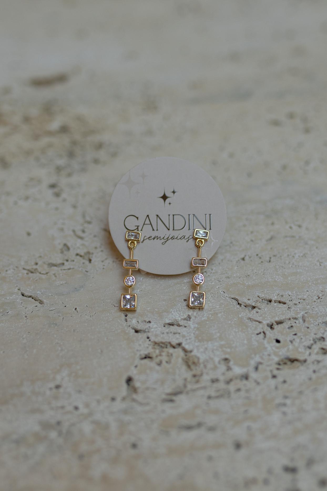 Brinco Pêndulo Zircônias Dourado