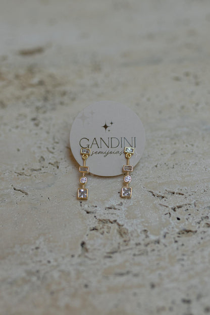 Brinco Pêndulo Zircônias Dourado