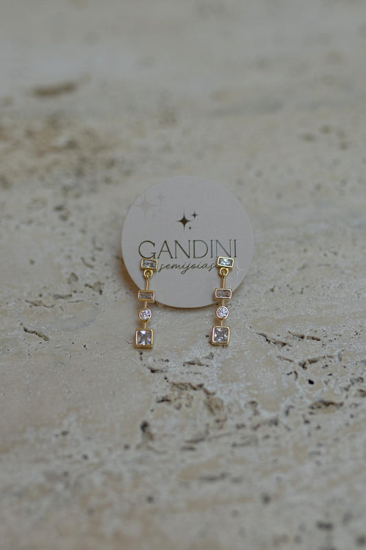 Brinco Pêndulo Zircônias Dourado