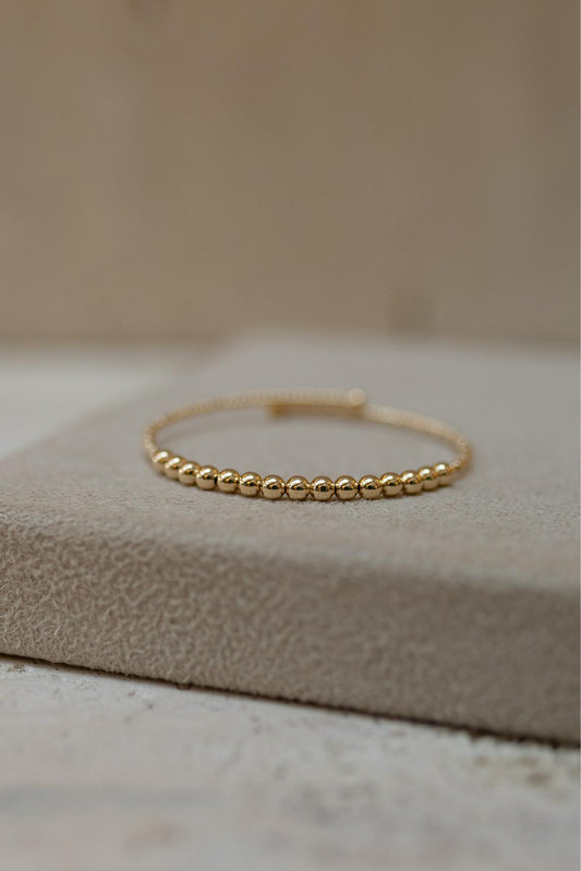 Bracelete Maleável Bolinhas Dourado