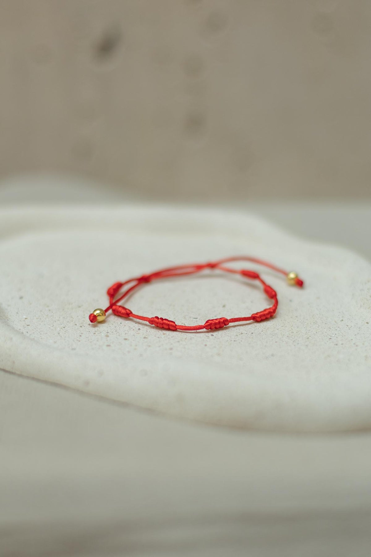 Pulseira 7 Nós Vermelha Dourado