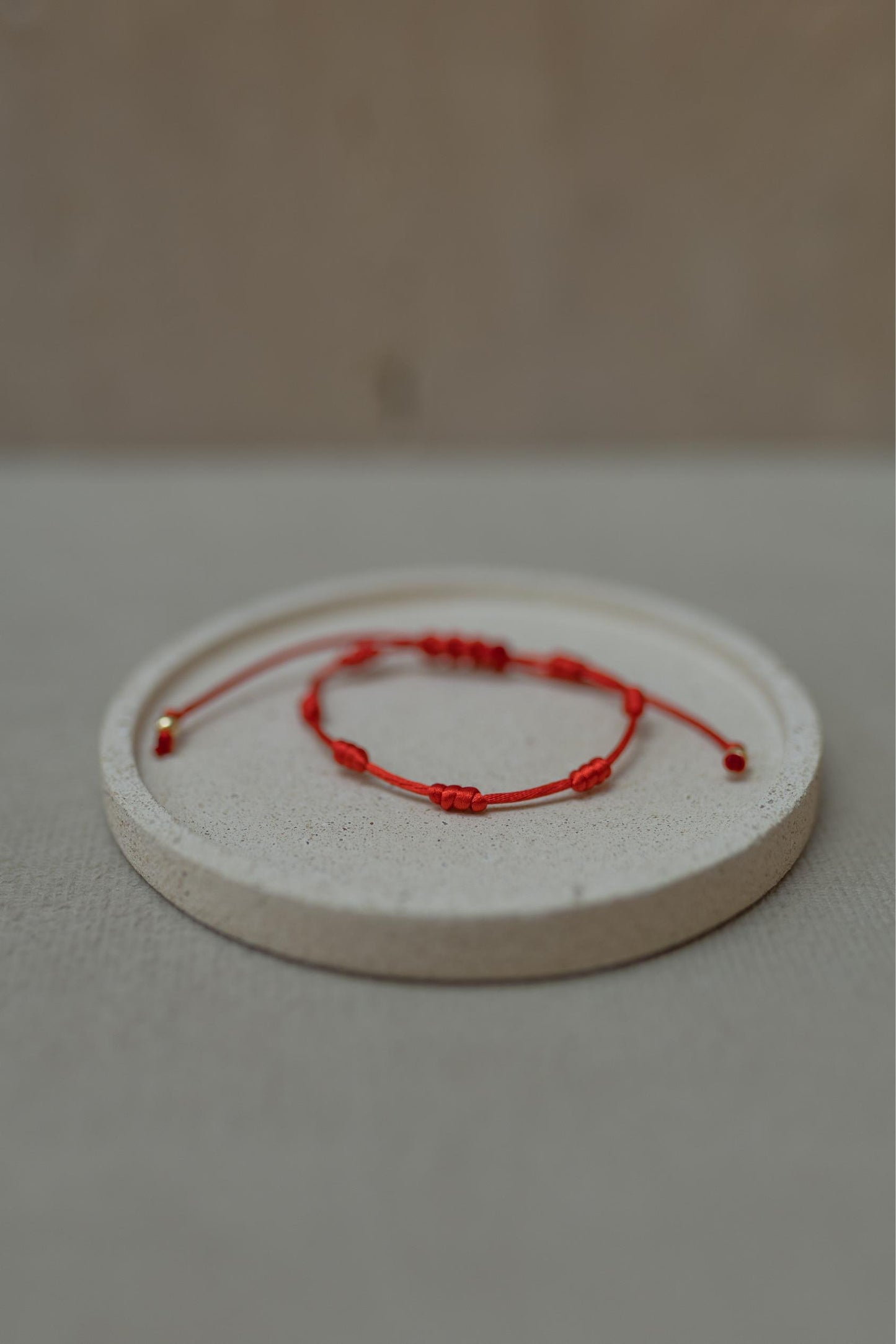 Pulseira 7 Nós Vermelha Dourado