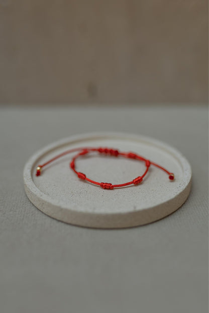Pulseira 7 Nós Vermelha Dourado