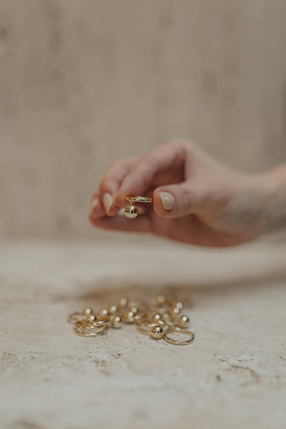 Anel Pingente Bola Dourado