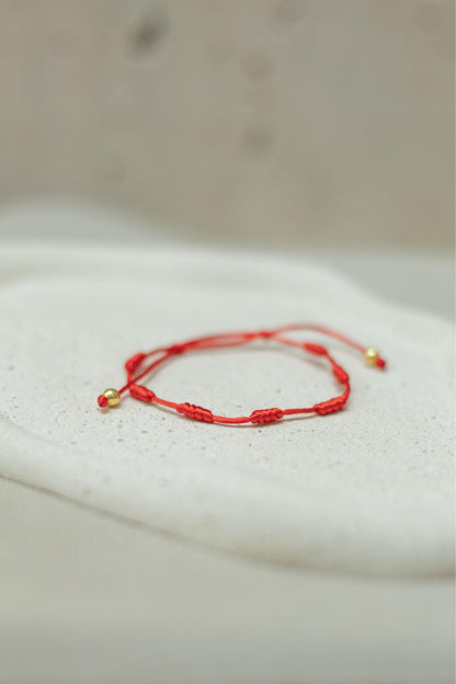Pulseira 7 Nós Vermelha Dourado