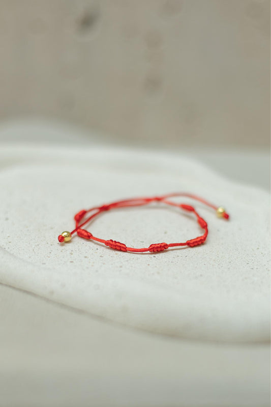 Pulseira 7 Nós Vermelha Dourado
