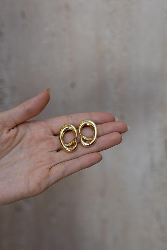 Brinco Movimento Oval Dourado